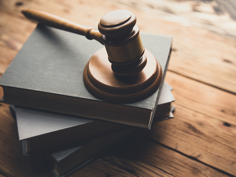 Law Book With A Wooden Judges Gavel